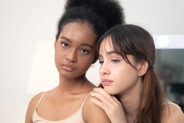 Beauty, skincare, wellness, comparison, multicultural young women with different skin tones bonding...