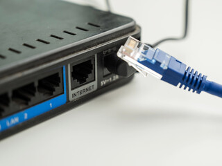 Naklejka na ściany i meble The internet cable is pulled out of the router. 