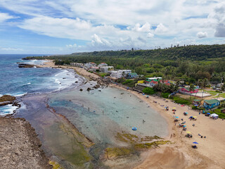 Homes and vacation rentals along Montones Beach near Isabela on the northwest side of the island of Puerto Rico in the Caribbean. 