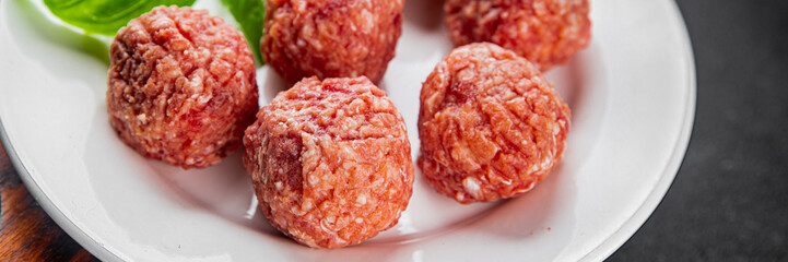 Meatballs raw meat pork, beef, chicken fresh delicious gourmet food background on the table rustic...
