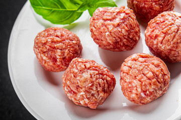 Meatballs raw meat pork, beef, chicken fresh delicious gourmet food background on the table rustic food top view copy space