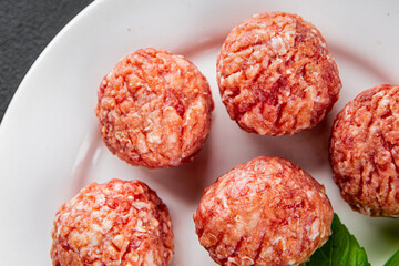 Meatballs raw meat pork, beef, chicken fresh delicious gourmet food background on the table rustic...