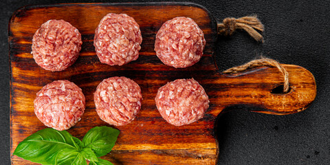 Meatballs raw meat pork, beef, chicken fresh delicious gourmet food background on the table rustic food top view copy space