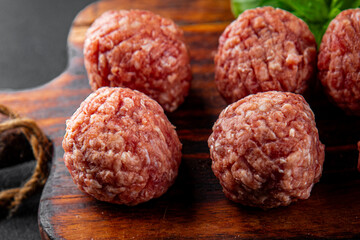 Meatballs raw meat pork, beef, chicken fresh delicious gourmet food background on the table rustic...
