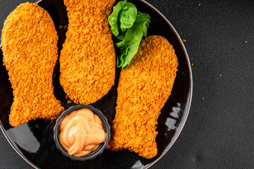 Fish sticks fishs shaped breaded fish nuggets fast food fresh delicious gourmet food background on...