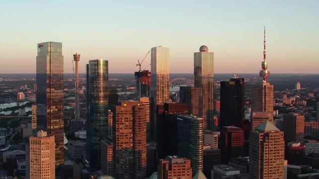 Aerial sunset view of Torontos downtown skyscrapers under construction, perfect for urban development websites, construction companies, and cityscape presentations. Suitable for commercial use.