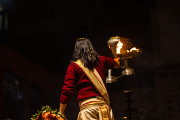 Ganga aarti, Portrait of an young unidentified male priest performing holy river ganga evening...