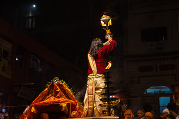 Ganga aarti, Portrait of an young unidentified male priest performing holy river ganga evening...