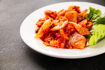 Kimchi pickled cabbage salad spicy savory vegetables fresh delicious gourmet food background on the table rustic food top view copy space vegetarian and vegan food