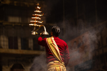 Ganga aarti, Portrait of an young unidentified male priest performing holy river ganga evening...