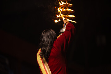 Ganga aarti, Portrait of an young unidentified male priest performing holy river ganga evening...