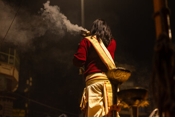 Ganga aarti, Portrait of an young unidentified male priest performing holy river ganga evening...