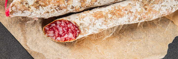 Dry-cured sausage pork meat smoked food fresh delicious gourmet food background on the table rustic food top view copy space