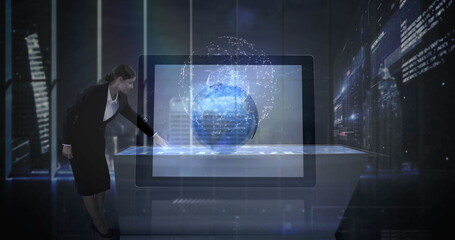 Interacting executive in suit operating touchscreen table at high-tech office, 3D globe, copy space