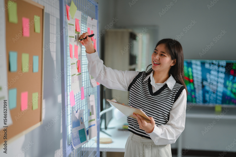 Poster Project manager writing on sticky notes attached to a grid, organizing tasks and scheduling appointments