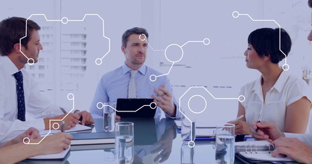 Presenting business professional holding tablet and speaking in conference room, with tech graphics