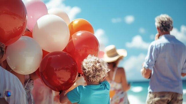 A joyful child stands with colorful balloons on a sunny beach, embodying the spirit of happiness and celebration, surrounded by people enjoying a beautiful day outdoors.
