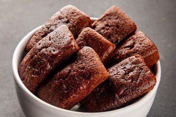 Financier biscuit chocolate cookie sweet dessert fresh delicious gourmet food background on the table rustic food top view copy space