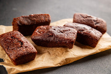 Financier biscuit chocolate cookie sweet dessert fresh delicious gourmet food background on the table rustic food top view copy space
