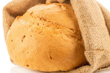 Loaf of white wheat bread, close-up, isolated on white background.