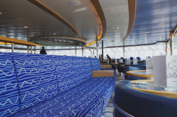 Luxurious modern observation or panorama lounge with floor to ceiling windows onboard expedition...