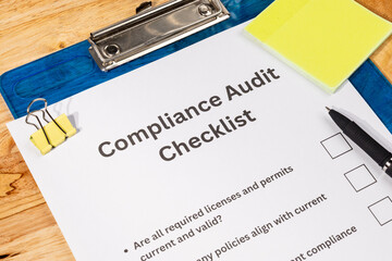 Compliance Audit Checklist Paper with Pen on Desk – Regulatory Inspection Scene