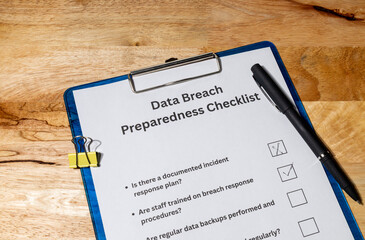 Cybersecurity Checklist Document with Pen – Data Breach Readiness and Protection Scene