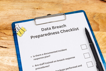 Data Breach Preparedness Checklist on Desk with Pen – Cybersecurity Planning Concept