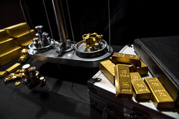 Gold and wealth concept. Weighing virgin gold nuggets. Bank gold bars. Gold reserve holdings. Savings and investments, business and finance