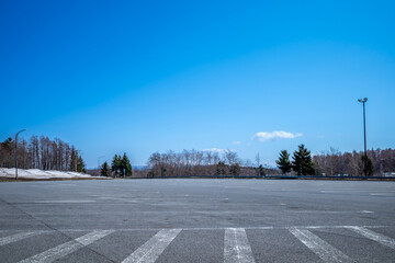 Road side parking area along toll road, view with surrounding under blue sky in winter