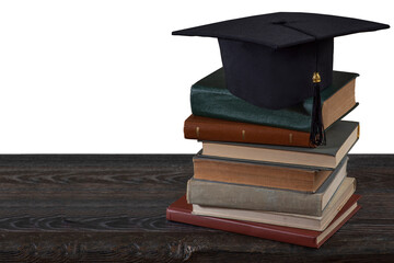 Stacks of books, Square academic cap or graduation hat. Concept of education, knowledge, intelligence