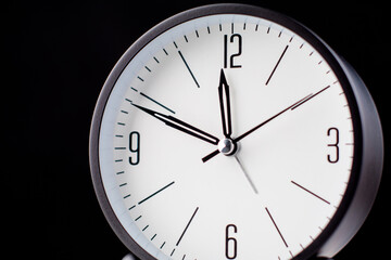 Clocks tell the time of work and life, processes and rules of limited time. Photo of clock in studio.
