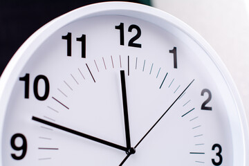 Clocks tell the time of work and life, processes and rules of limited time. Photo of clock in studio.
