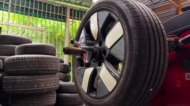  Performing a dynamic tire rotation process in a fully equipped workshop environment