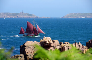 Sailboat on the Pink Granite Coast in Brittany in France, Europe
