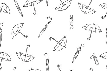 Seamless pattern with umbrellas in doodle style.