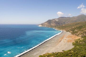 A breathtaking landscape showcases a pristine coastline, sparkling turquoise waters, and majestic...