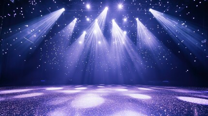 Bright stage spotlights illuminate an empty performance area with a purple haze and sparkling floor.