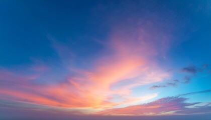 twilight sky with effect of light in pastel pink coral orange blue tones colorful sunset of soft clouds background
