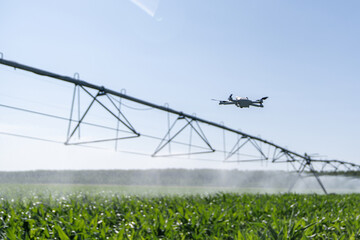 Drone controls pivot irrigation system on an agricultural field