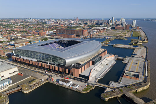 Aerial image of Everton New Stadium with Liverpool City Skyline on the background 