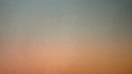 soft textured gradient sky in warm peach and cool blue tones ideal for minimalist background, print...