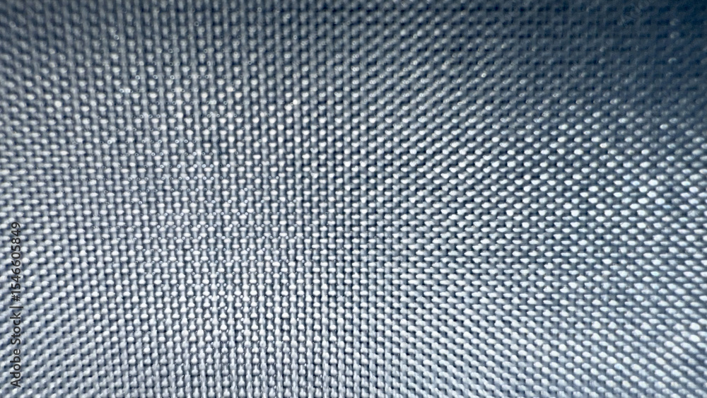 Poster close-up texture of metallic mesh grid with radial light reflection pattern in dark blue tones, ideal for tech background, product packaging, or digital design

