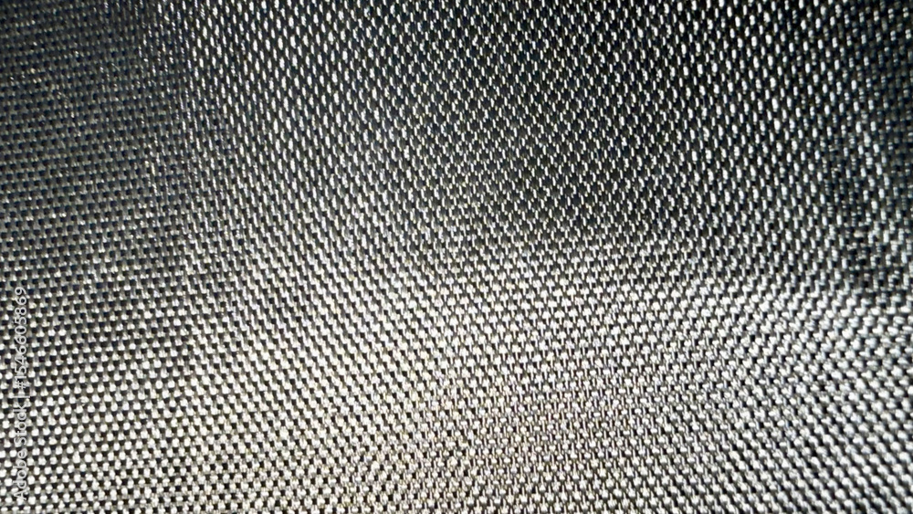 Poster close-up of metallic mesh texture with reflective silver fibers and geometric weave pattern ideal for industrial web design, tech branding, futuristic print media

