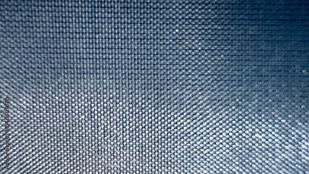 Poster close-up texture of metallic mesh grid with radial light reflection pattern in dark blue tones, ideal for tech background, product packaging, or digital design


