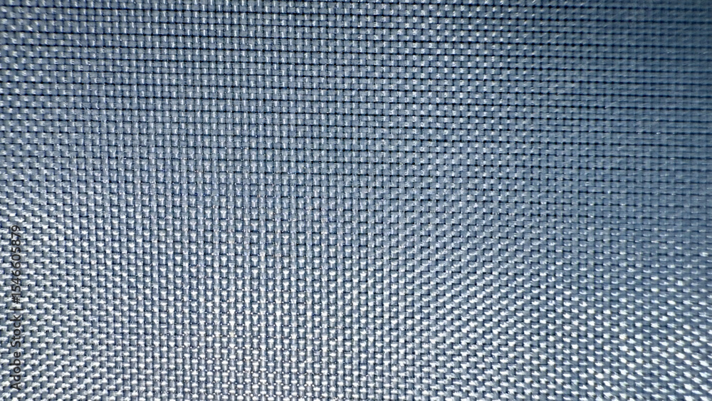 Fototapete close-up texture of metallic mesh grid with radial light reflection pattern in dark blue tones, idea