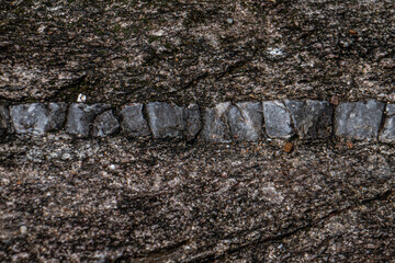 texture de rocher en granit avec des inclusions