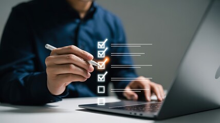 Closeup Hands Using Stylus Marking Checklist on Laptop Screen Dark Blue Shirt image