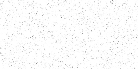Abstract background of randomly scattered geometric shapes in shades of gray creating a textured surface aesthetic design