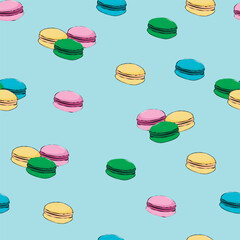seamless pattern with colorful macaroons on a blue background
